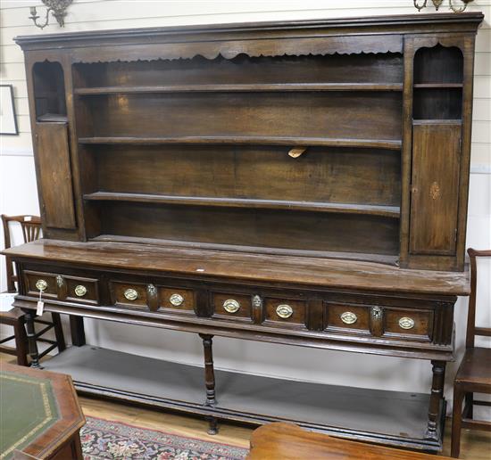 An 18th century oak dresser, W.7ft 9in. D.1ft 7in. H.6ft 6in.